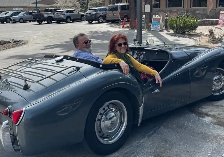 Shahri out exploring the neighborhoods in a classic convertible
